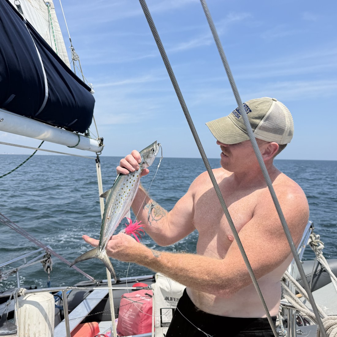 Jason holding a fresh catch on deck