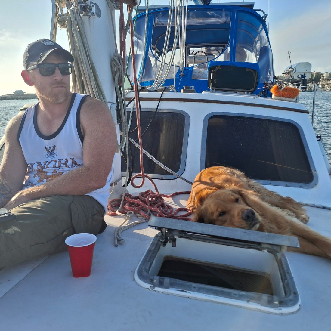 Jayme relaxing on deck with Sunny