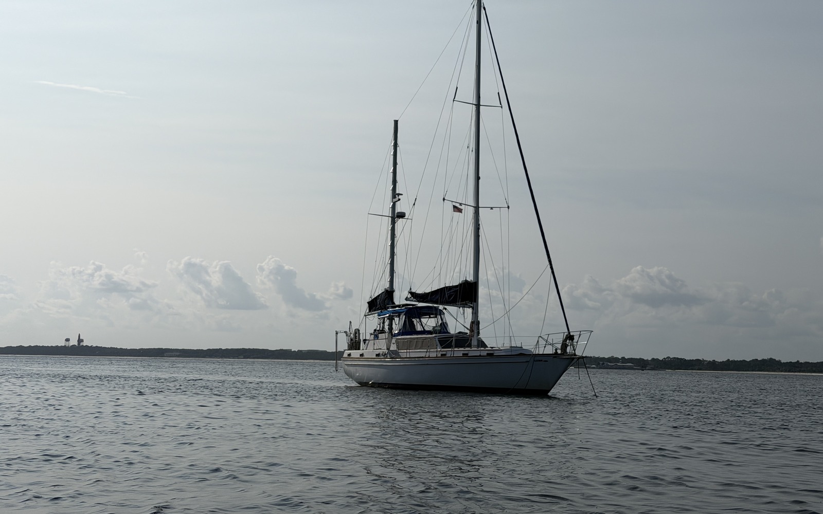 Koyukon riding at anchor under a cloudy sky